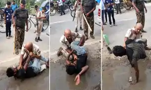 सड़क पर पुलिस और युवक के बीच उठापटक, वर्दी फाड़ी, Video वायरल