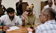 कुर्सी पर बैठे रहे अधिकारी, सामने बैठा रहा कुत्ते की वेश में फरियादी-The officer remained seated on the chair, while the complainant dressed as a dog sat in front of him कुर्सी पर बैठे रहे अधिकारी, सामने बैठा रहा कुत्ते की वेश में फरियादी-The officer remained seated on the chair, while the complainant dressed as a dog sat in front of him